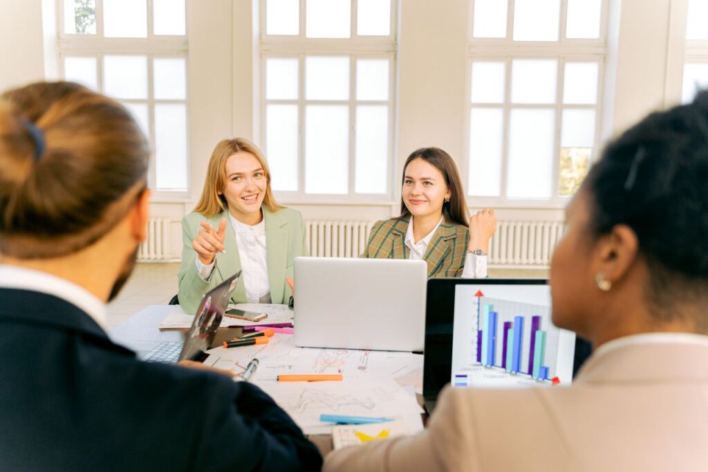 Why Leadership Development Is the Competitive Advantage in 2026 Cross-functional business team collaborating on strategic planning and innovation.